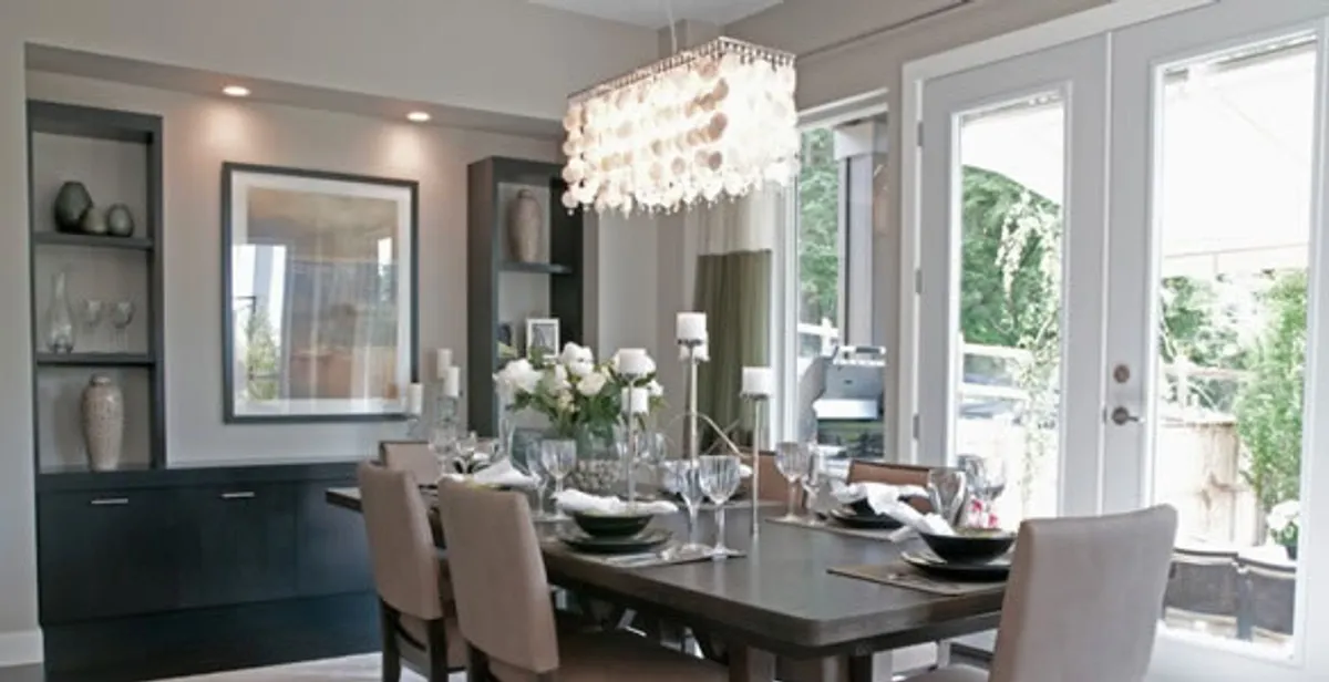 Elegant dining room chandelier installation above table in Reno, NV