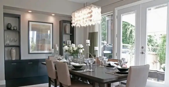 Elegant dining room chandelier installation above table in Reno, NV