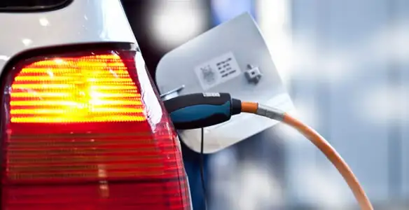 Electric car plugged into EV charger after professional installation in Reno, NV