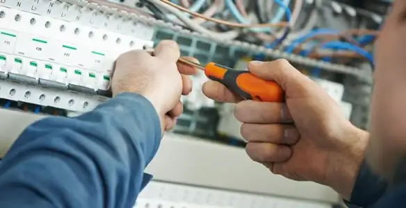 electrical service showing licensed electrician performing electrical panel maintenance and adjustments in Reno, NV