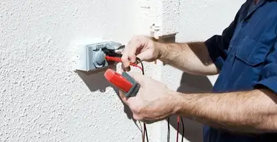 Electrician performing home electrical outlet and wiring inspection in Reno, NV