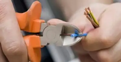 professional electrical services showing precise wire cutting by licensed electricians in Reno, NV
