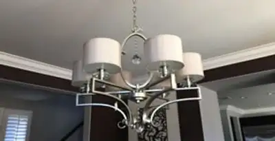 Modern chandelier installation with multiple light fixtures in Reno, NV