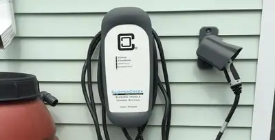 Outdoor electric vehicle charger installation on residential wall in Reno, NV