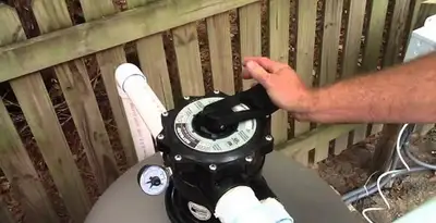 pool pumps service showing professional adjustment of pool pump control system in Reno, NV