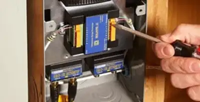 Whole home surge protection device being installed by a licensed electrician to protect electrical systems in Reno, NV